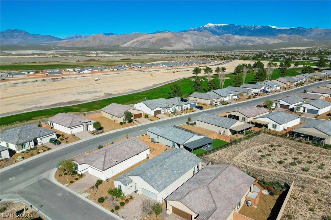 4743 South Springridge Street Pahrump, NV 89061 - Photo 40 of 50 Aerial view of residential area featuring a mountainous background