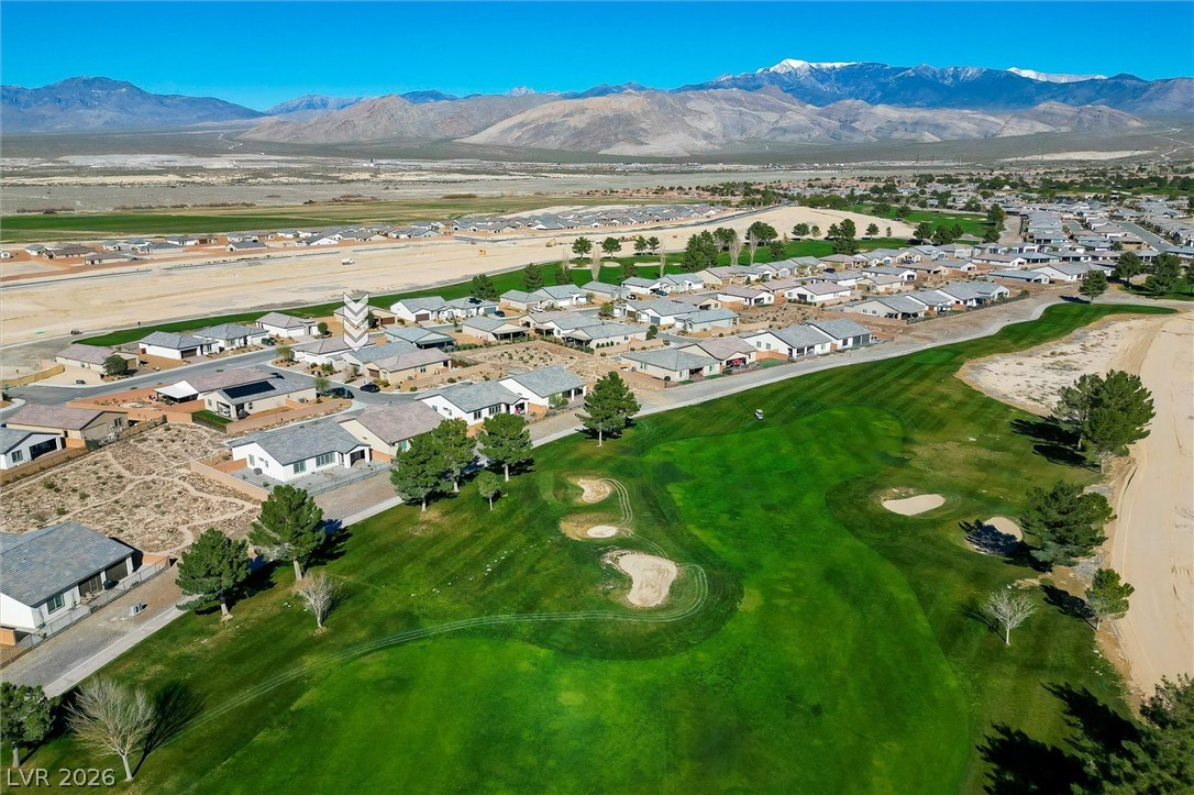 4743 South Springridge Street Pahrump, NV 89061 - Photo 47 of 50 Aerial view of residential area featuring a mountain backdrop and a local golf course