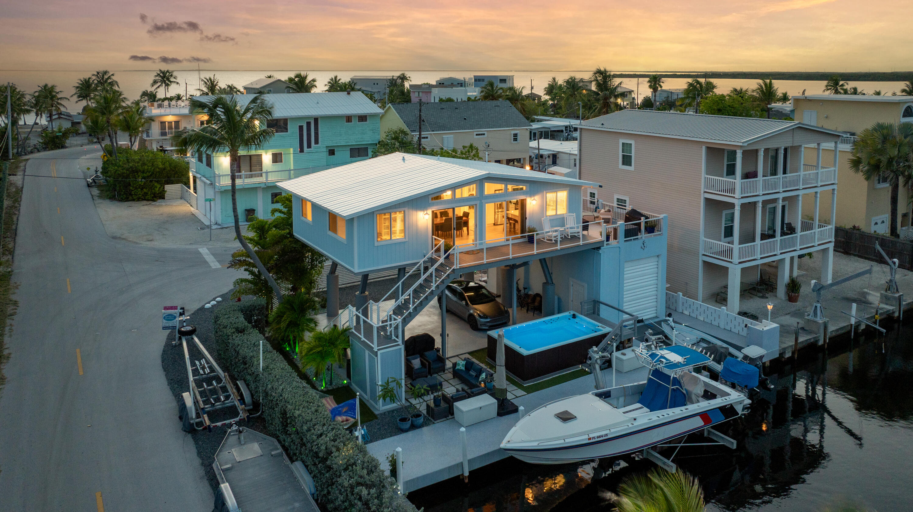 1 Snipe Road Key Largo, FL 33037 - Photo 52 of 55 an aerial view of a house with balcony and outdoor seating