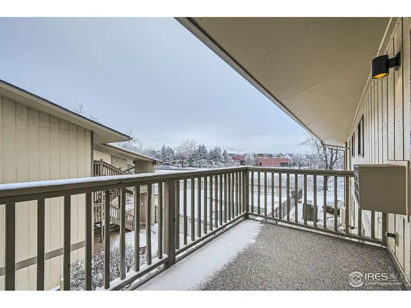 a balcony with wooden floor
