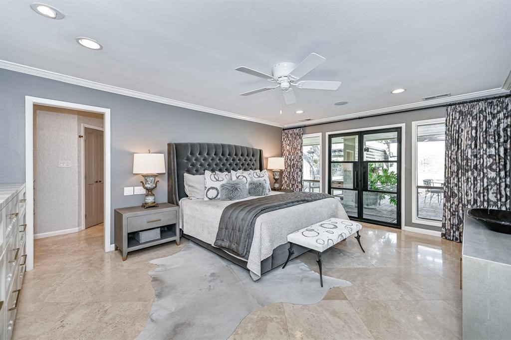 1038 Winner Foster Road Richmond, TX 77406 - Photo 12 of 37 a bedroom with a large bed and a tv