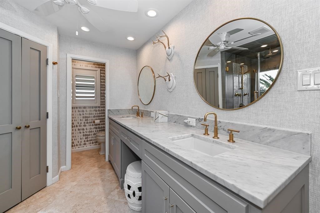 1038 Winner Foster Road Richmond, TX 77406 - Photo 24 of 37 a en suite bathroom with a granite countertop sink and a mirror