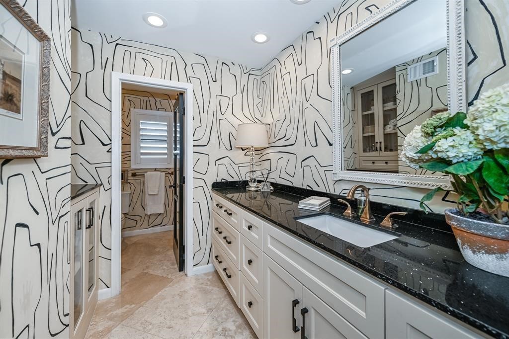 1038 Winner Foster Road Richmond, TX 77406 - Photo 25 of 37 a bathroom with double vanity sink a mirror and a shower