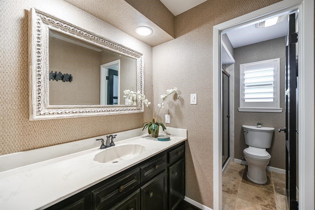 1038 Winner Foster Road Richmond, TX 77406 - Photo 29 of 37 a bathroom with a granite countertop sink mirror and toilet