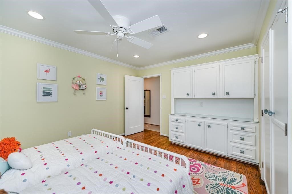 1038 Winner Foster Road Richmond, TX 77406 - Photo 31 of 37 a bedroom with a bed and a dresser