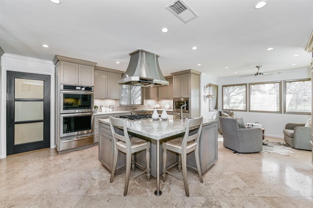 1038 Winner Foster Road Richmond, TX 77406 - Photo 5 of 37 a kitchen with a table and chairs in it