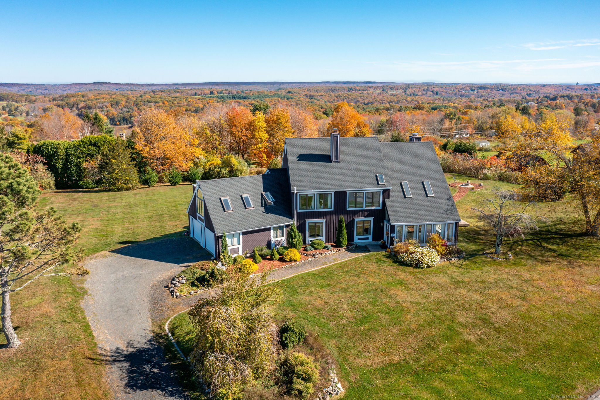 an aerial view of a house with a ocean view