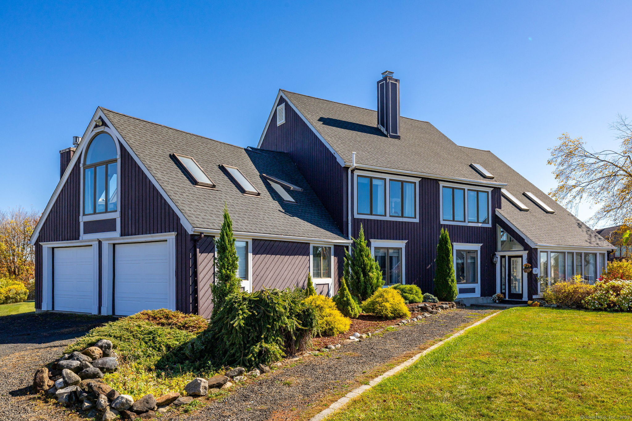 57 Bayview Circle Watertown, CT 06795 - Photo 14 of 40 a front view of a house with garden