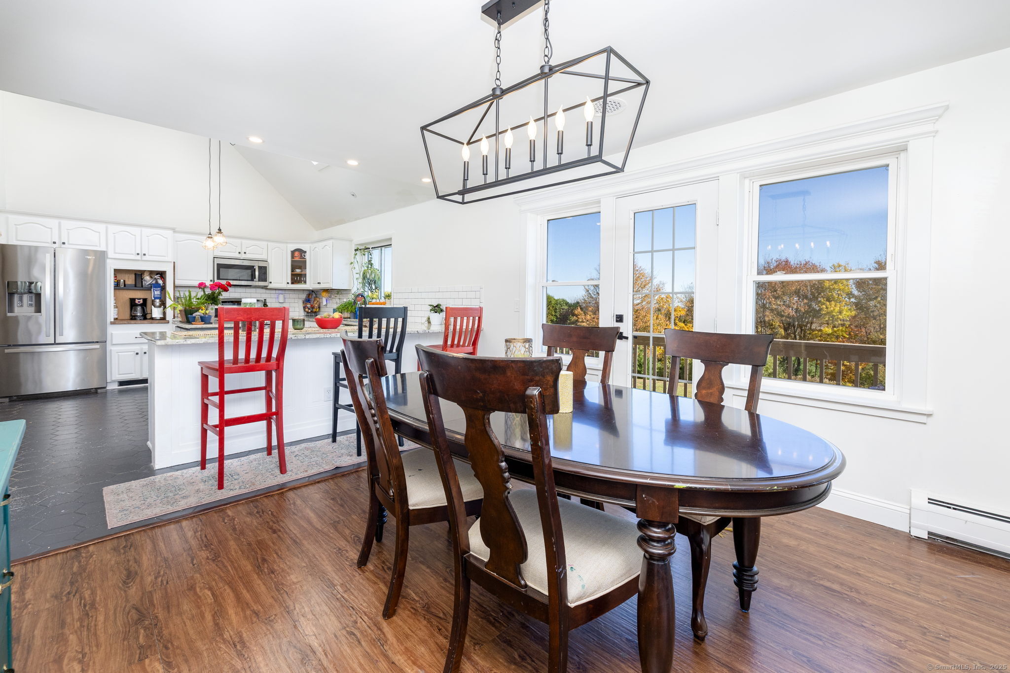 57 Bayview Circle Watertown, CT 06795 - Photo 18 of 40 a view of a dining room with furniture wooden floor and chandelier