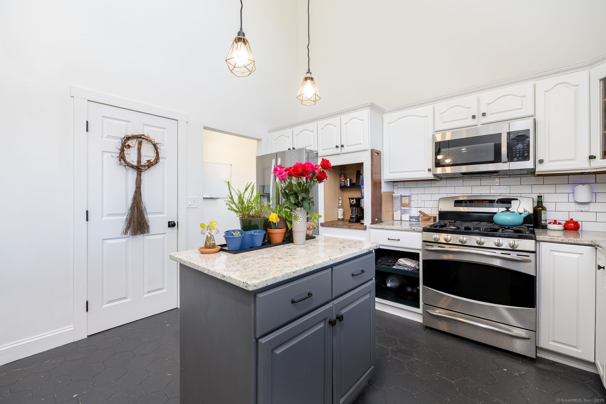 57 Bayview Circle Watertown, CT 06795 - Photo 21 of 40 a kitchen with stainless steel appliances granite countertop a sink stove and refrigerator
