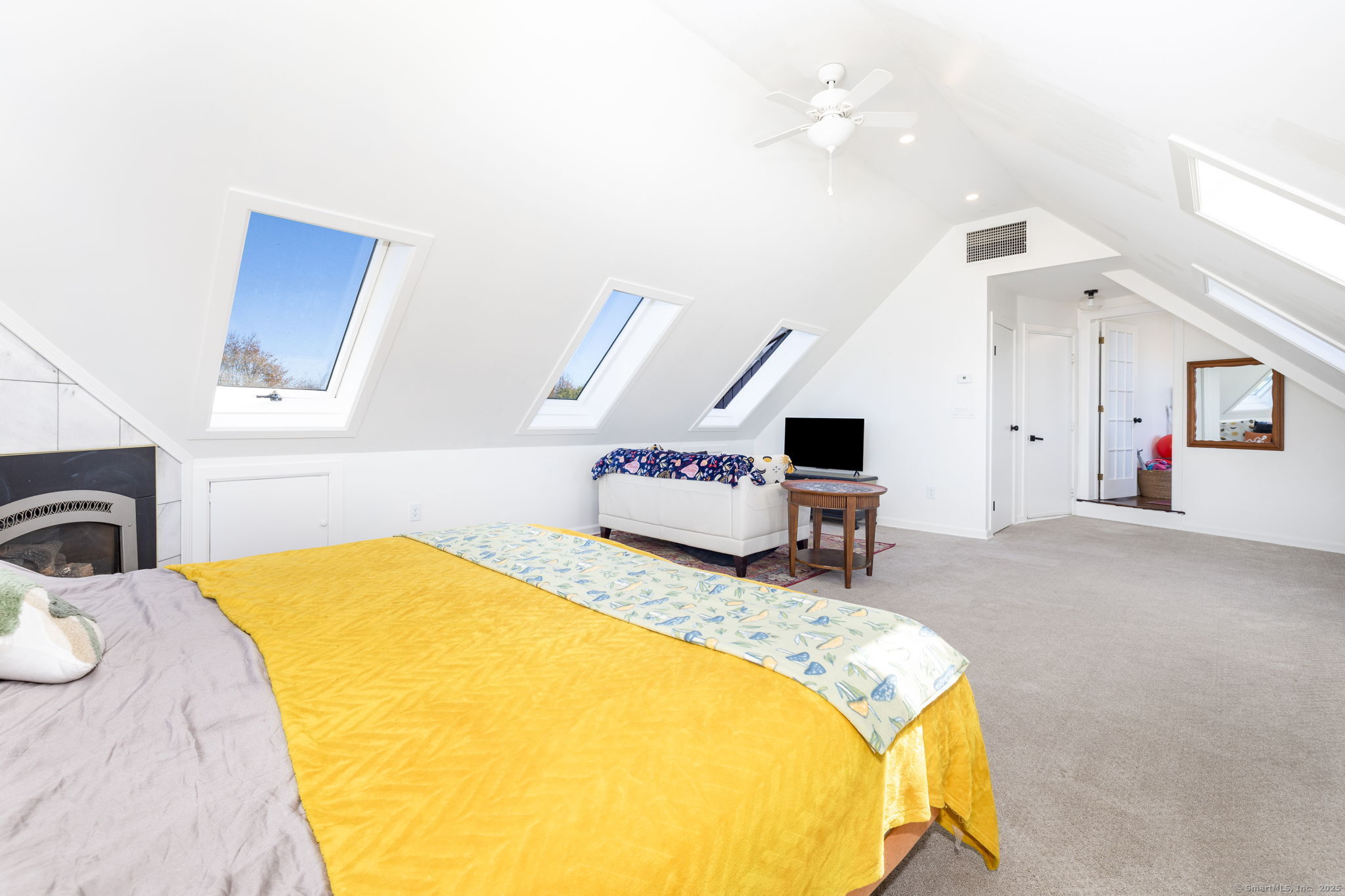 57 Bayview Circle Watertown, CT 06795 - Photo 25 of 40 a bedroom with a bed and a chandelier