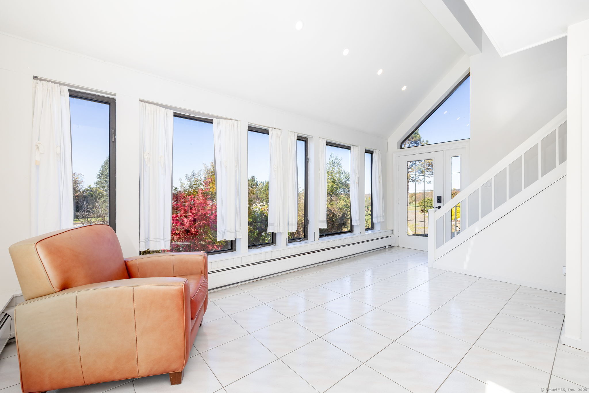 57 Bayview Circle Watertown, CT 06795 - Photo 28 of 40 a living room with furniture and a large window