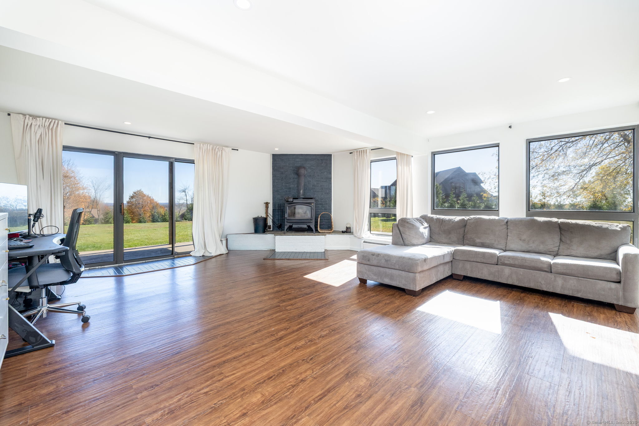 57 Bayview Circle Watertown, CT 06795 - Photo 29 of 40 a living room with furniture and a wooden floor
