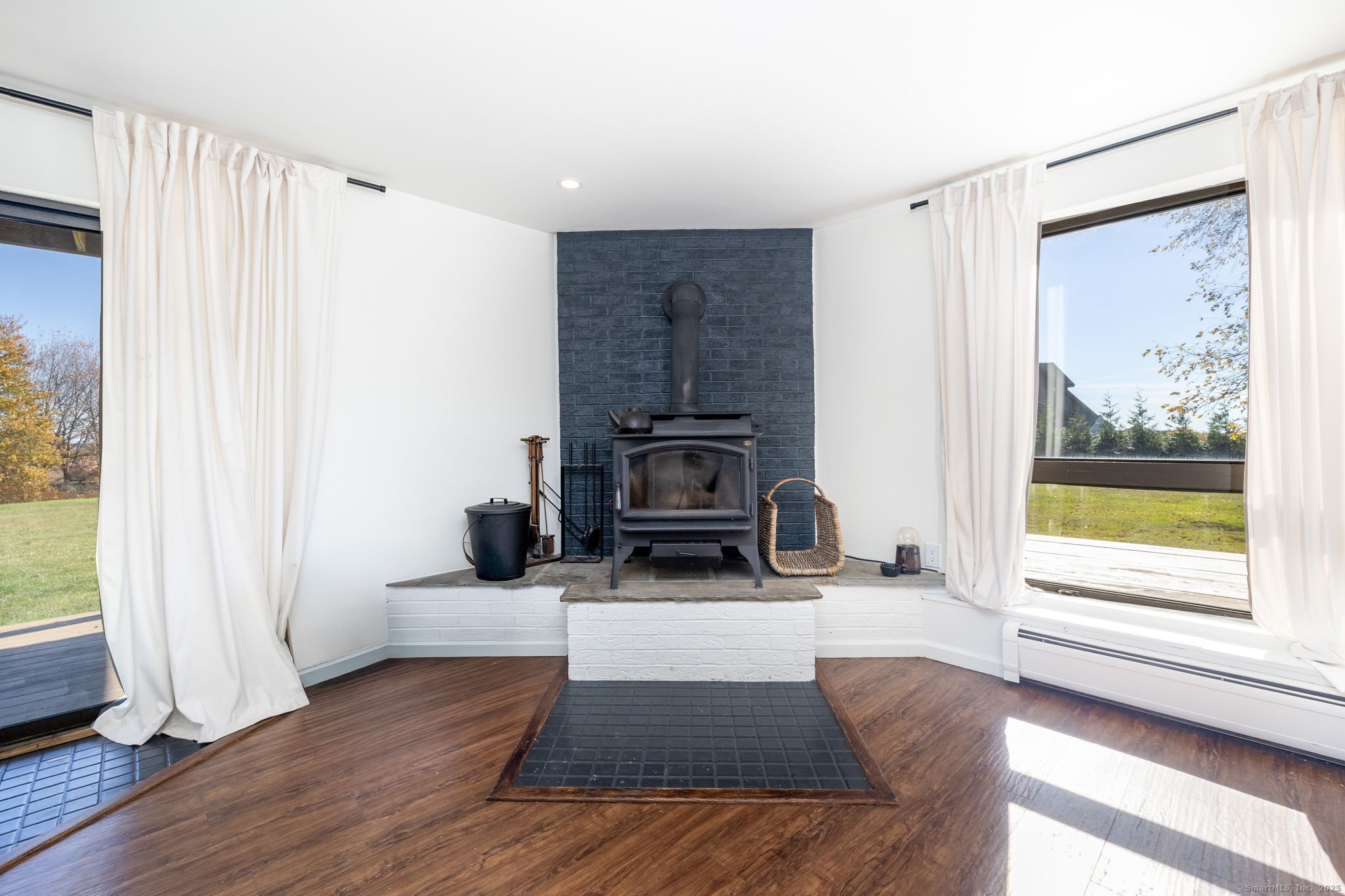 57 Bayview Circle Watertown, CT 06795 - Photo 30 of 40 a living room with furniture and a fireplace