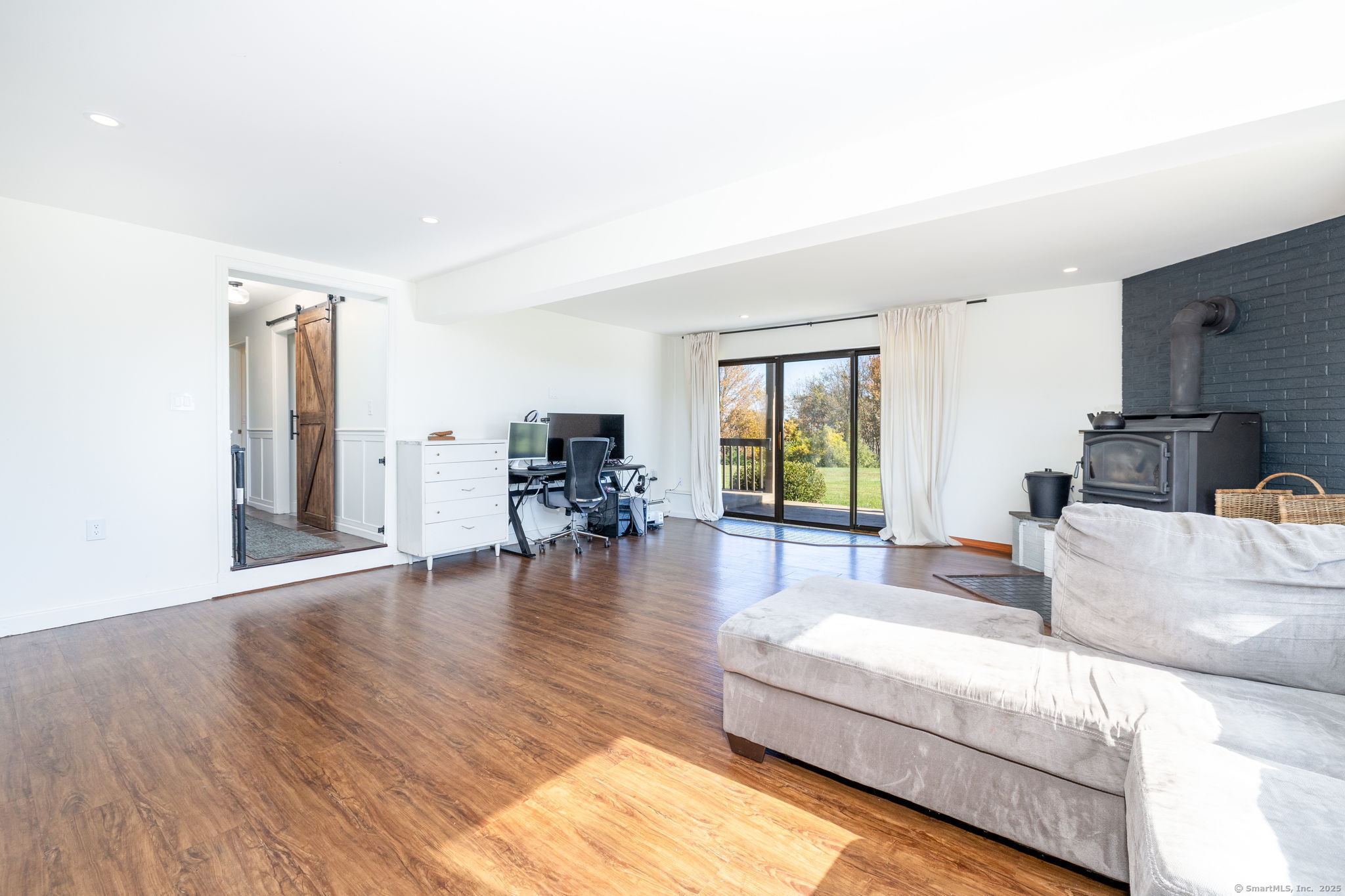 57 Bayview Circle Watertown, CT 06795 - Photo 31 of 40 a living room with furniture and a large window
