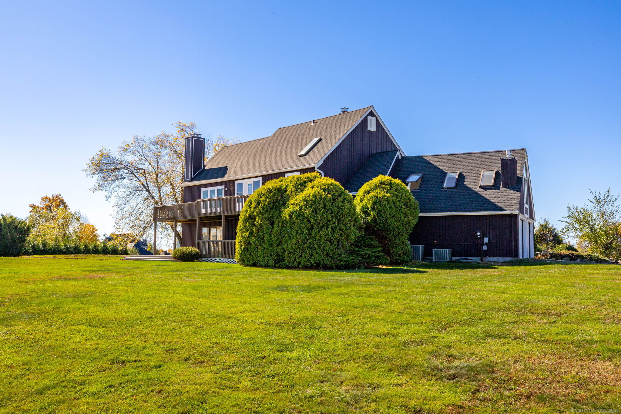 57 Bayview Circle Watertown, CT 06795 - Photo 38 of 40 a view of a big house with a big yard and large trees