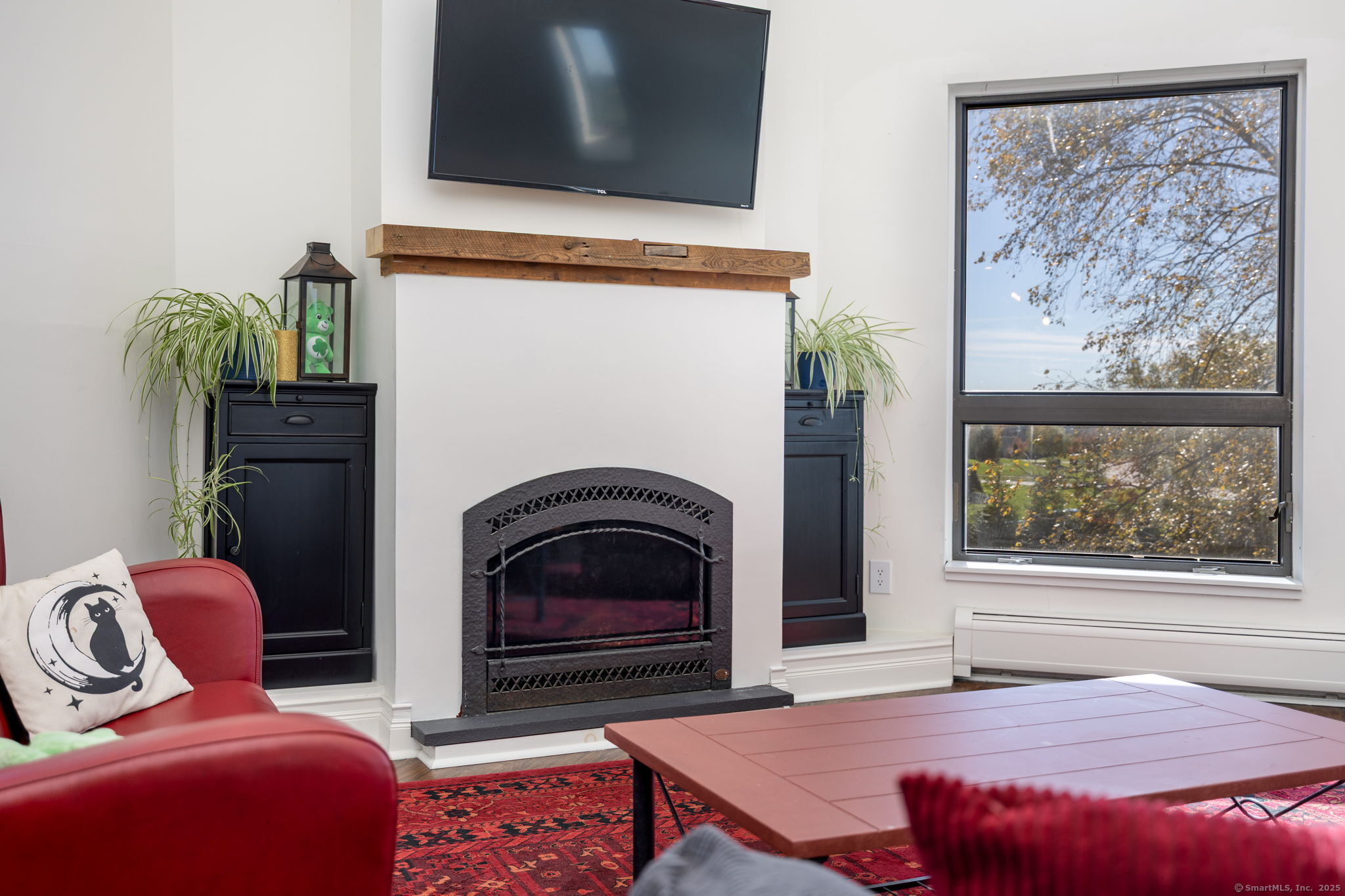 57 Bayview Circle Watertown, CT 06795 - Photo 40 of 40 a bedroom with a bed and a fireplace