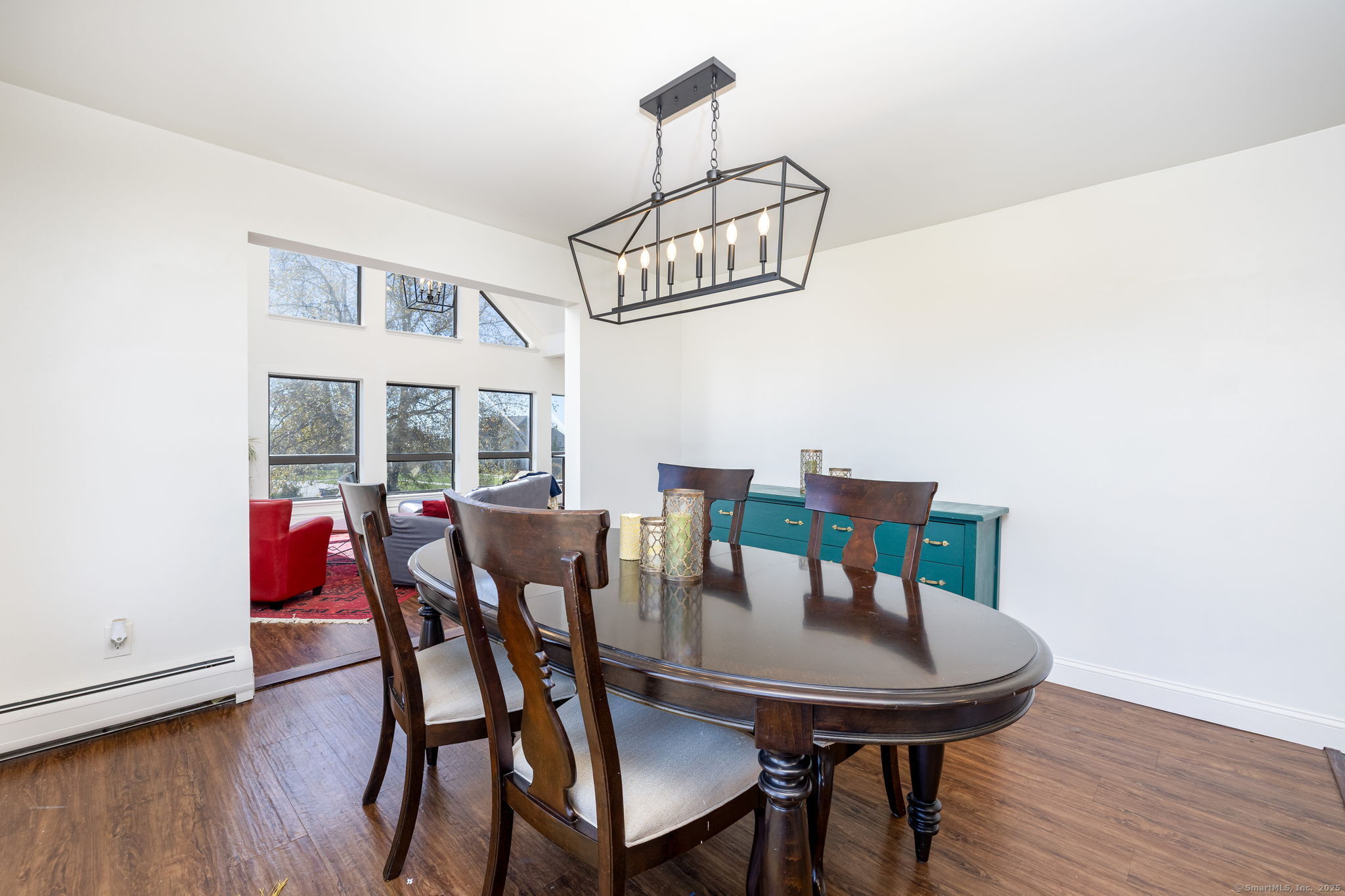 57 Bayview Circle Watertown, CT 06795 - Photo 5 of 40 a view of a dining room with furniture and wooden floor