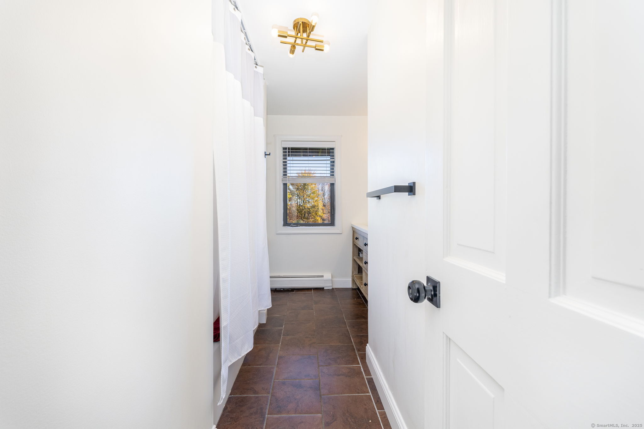 57 Bayview Circle Watertown, CT 06795 - Photo 8 of 40 a view of a hallway with windows