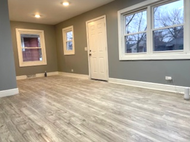 14825 Maplewood Avenue Harvey, IL 60426 - Photo 3 of 9 a view of an empty room with a window