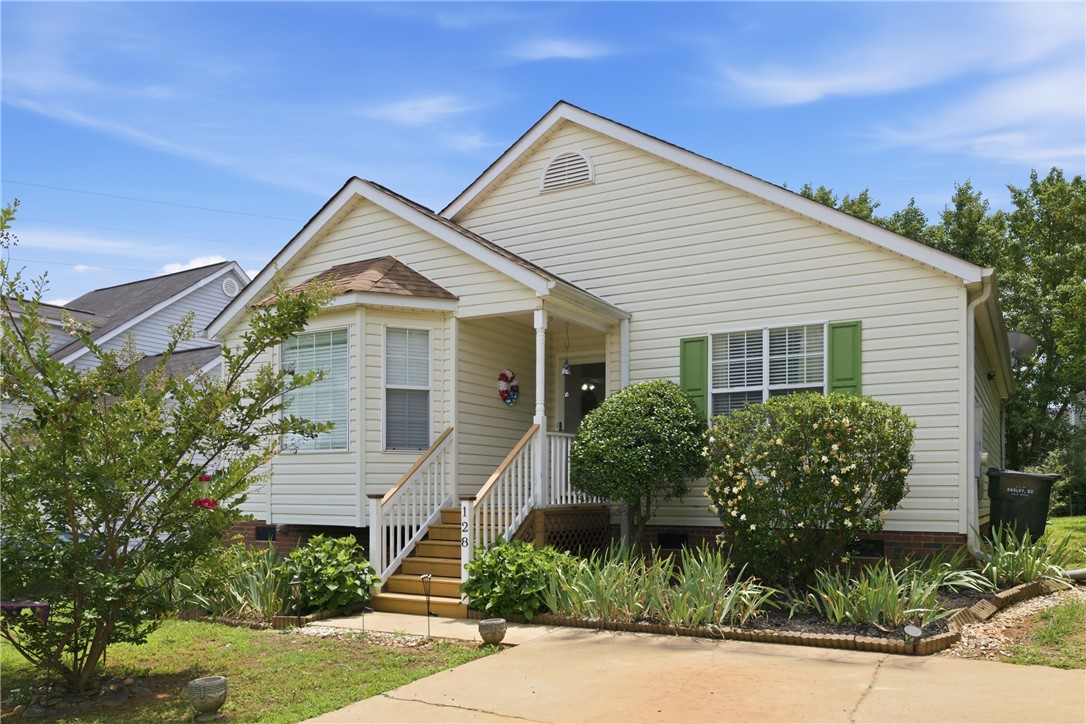 128 Kelly Lane Easley, SC 29642 - Photo 1 of 23 A welcoming facade presents a porch entry, inviting guests to a comfortable home.