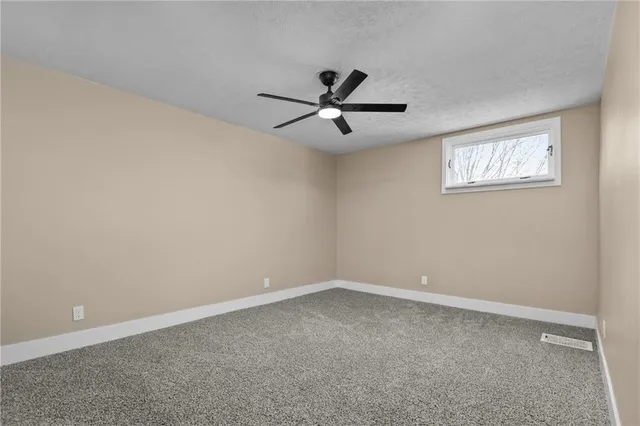 a view of a big room with carpet