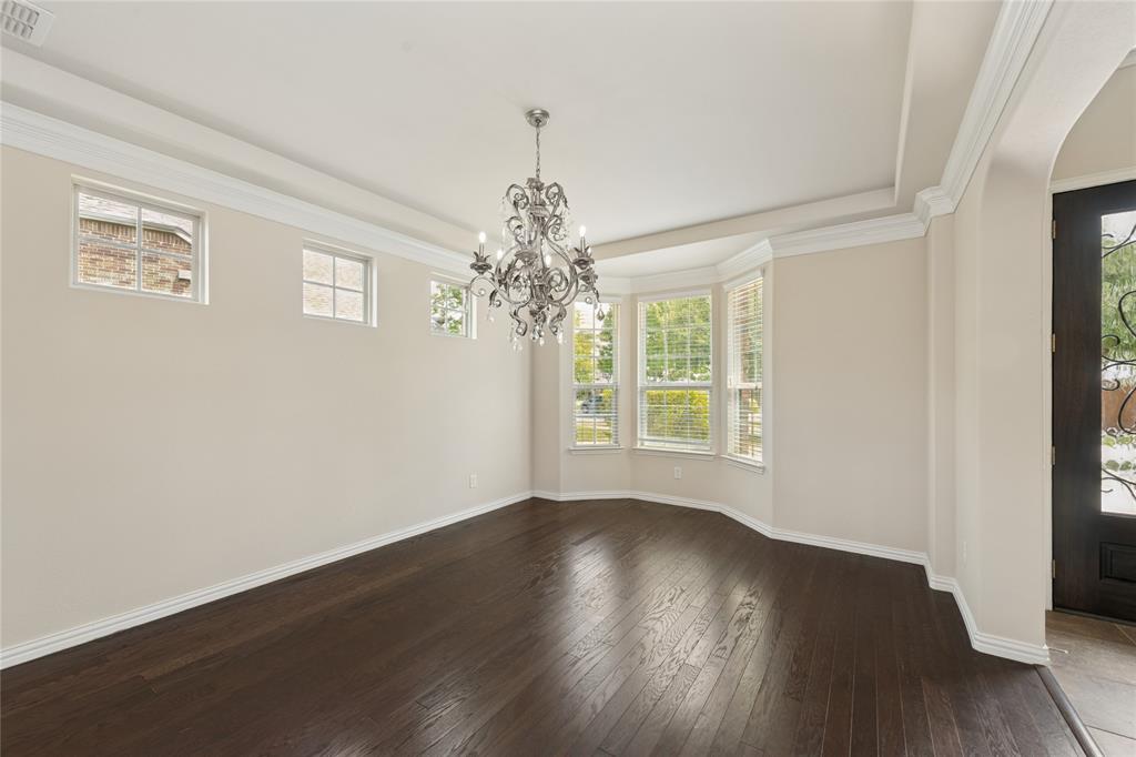 12571 Valley Spring Drive Frisco, TX 75035 - Photo 5 of 39 a view of a room with wooden floor and large window