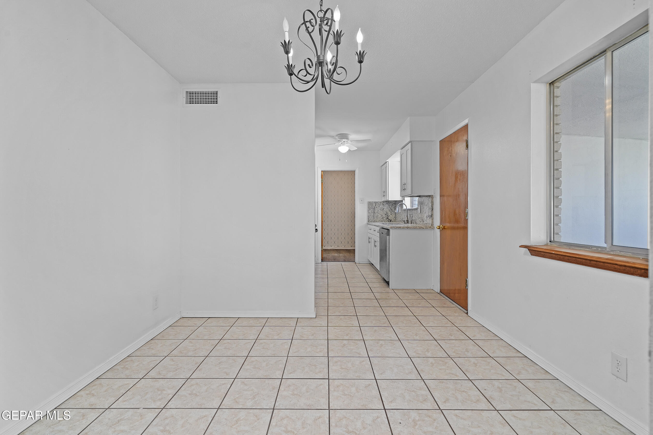 416 San Saba Road El Paso, TX 79912 - Photo 15 of 41 a view of a kitchen with a sink and dishwasher kitchen view