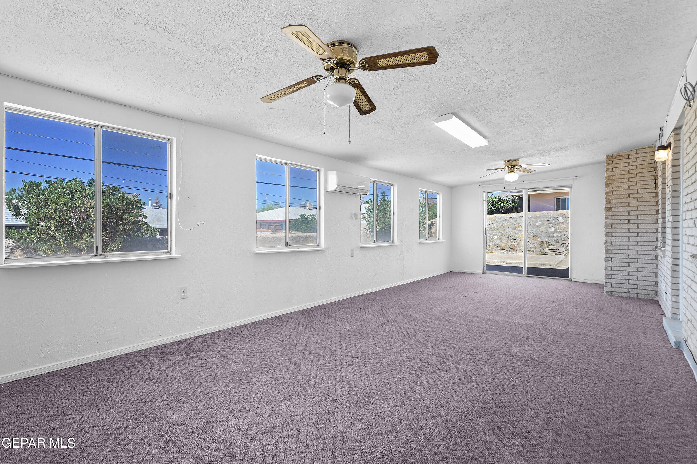 416 San Saba Road El Paso, TX 79912 - Photo 21 of 41 a view of livingroom with hardwood floor and a ceiling fan