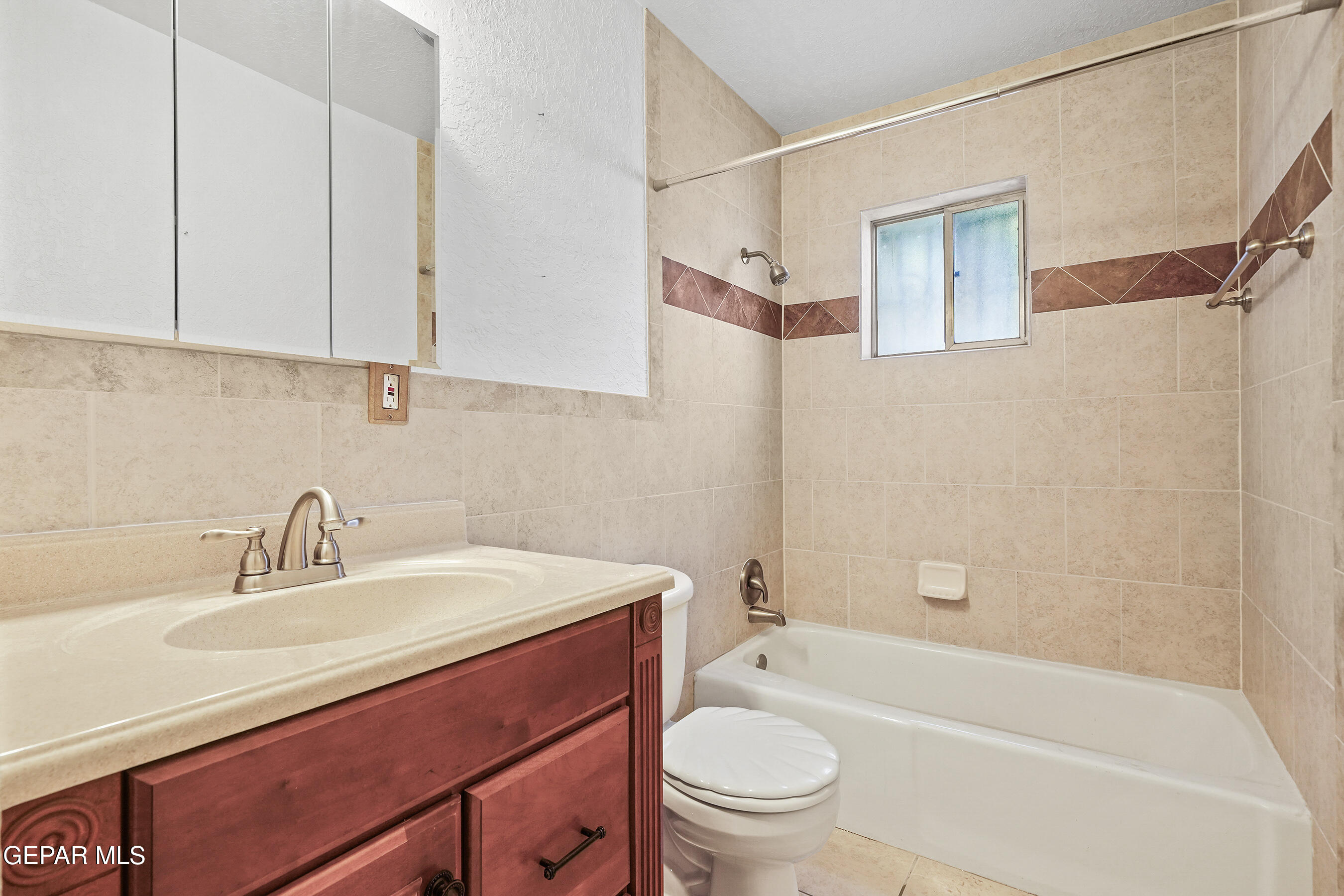 416 San Saba Road El Paso, TX 79912 - Photo 30 of 41 a bathroom with a sink a toilet and bathtub