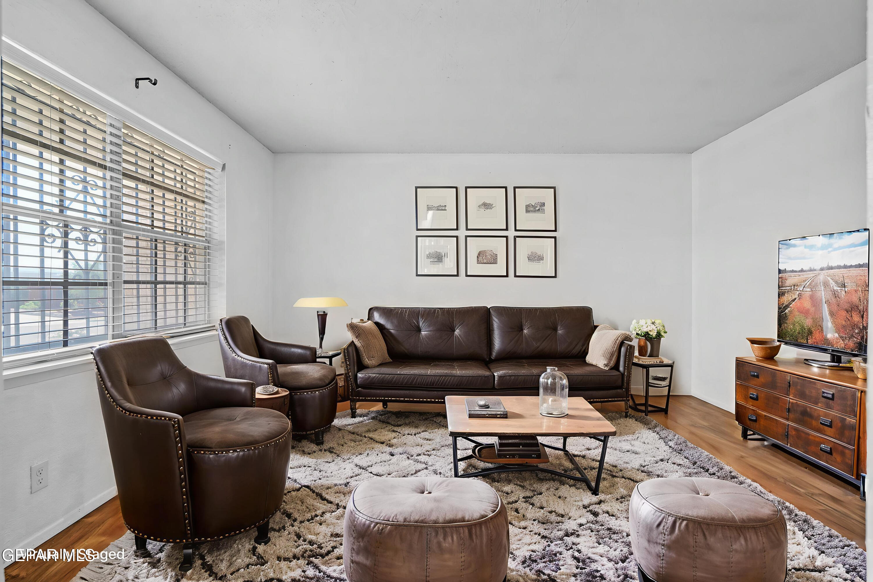416 San Saba Road El Paso, TX 79912 - Photo 3 of 41 a living room with furniture a rug and a flat screen tv