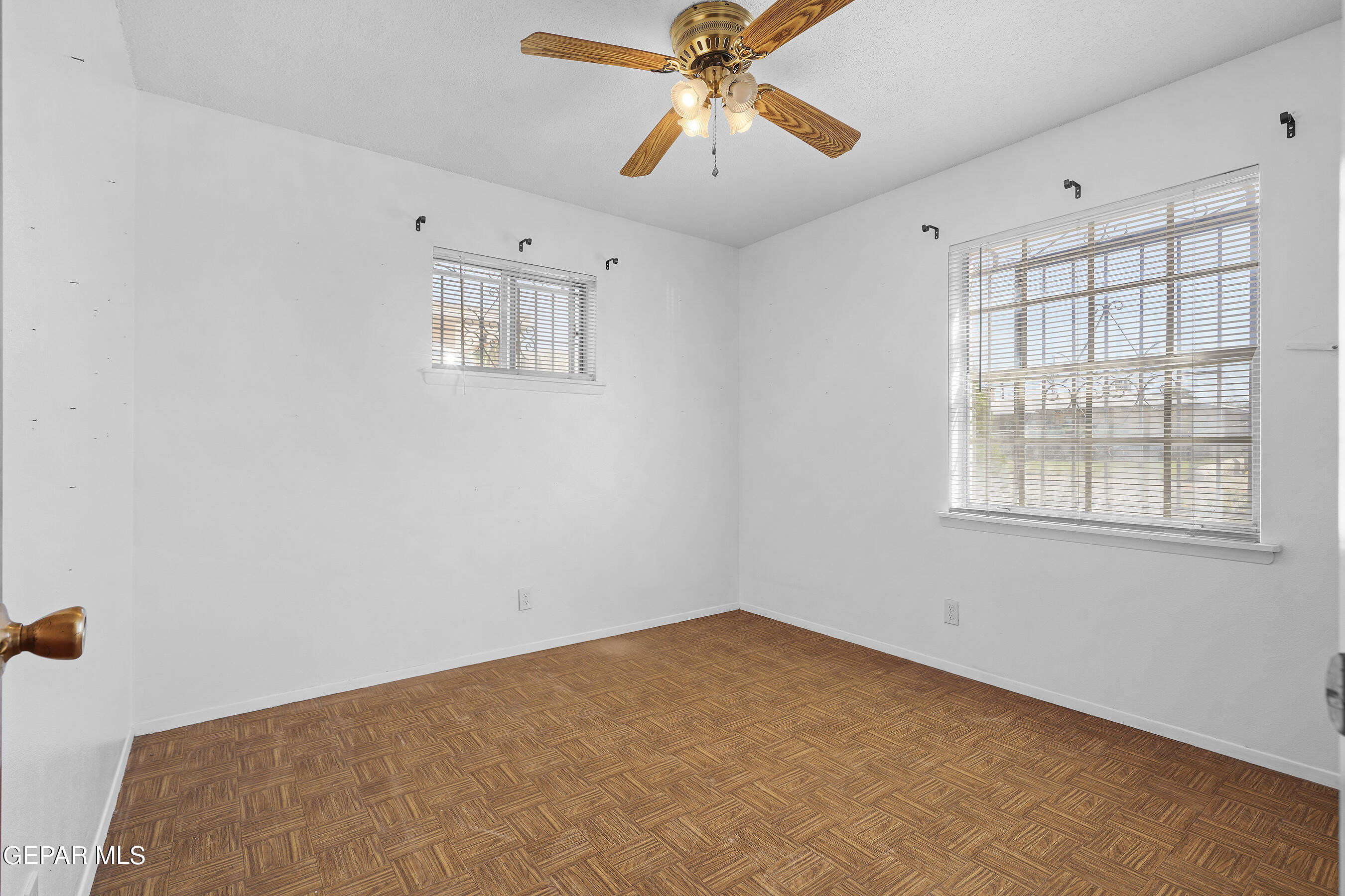 416 San Saba Road El Paso, TX 79912 - Photo 32 of 41 a view of a room with a ceiling fan and a window