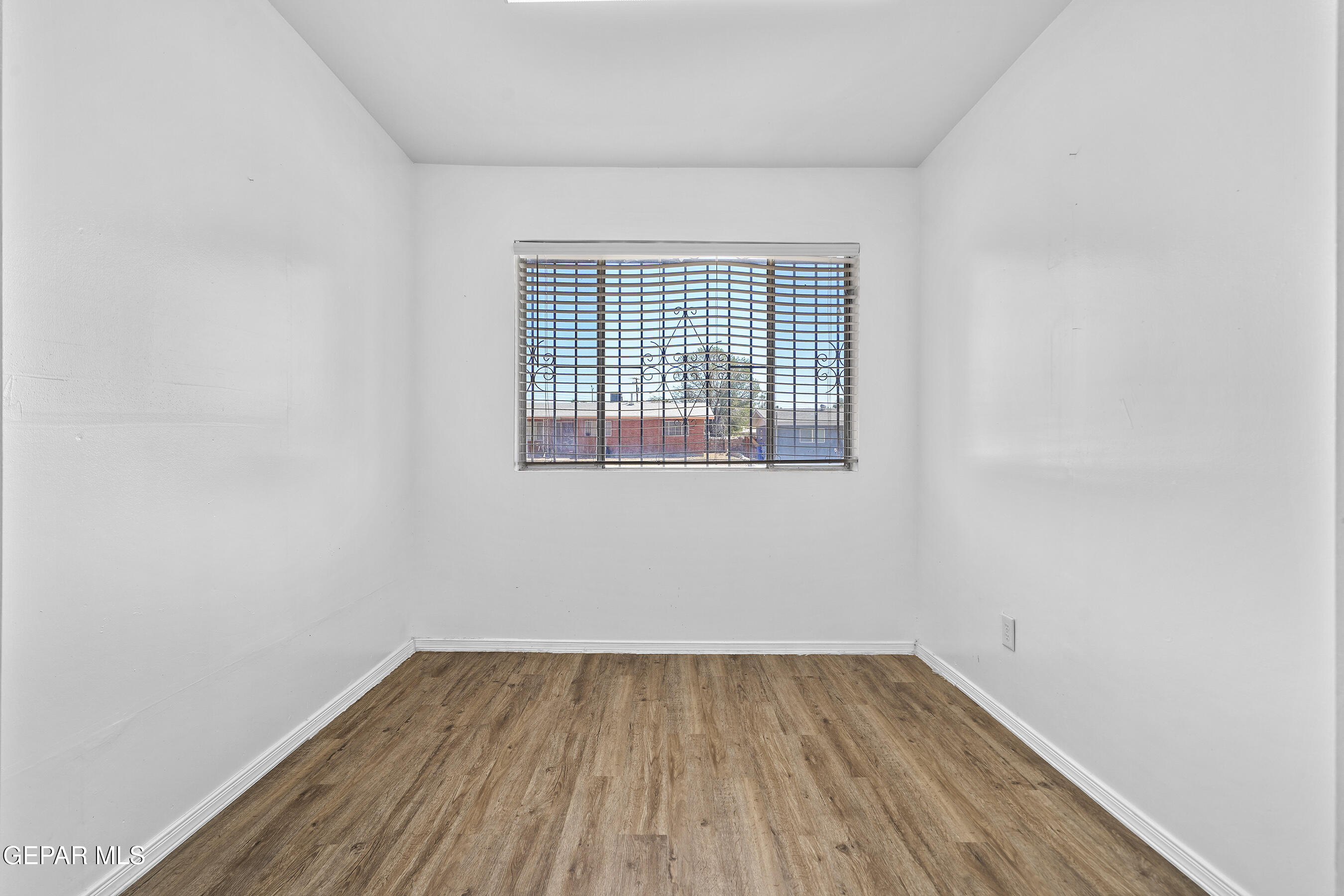 416 San Saba Road El Paso, TX 79912 - Photo 34 of 41 a view of a room with wooden floor and window