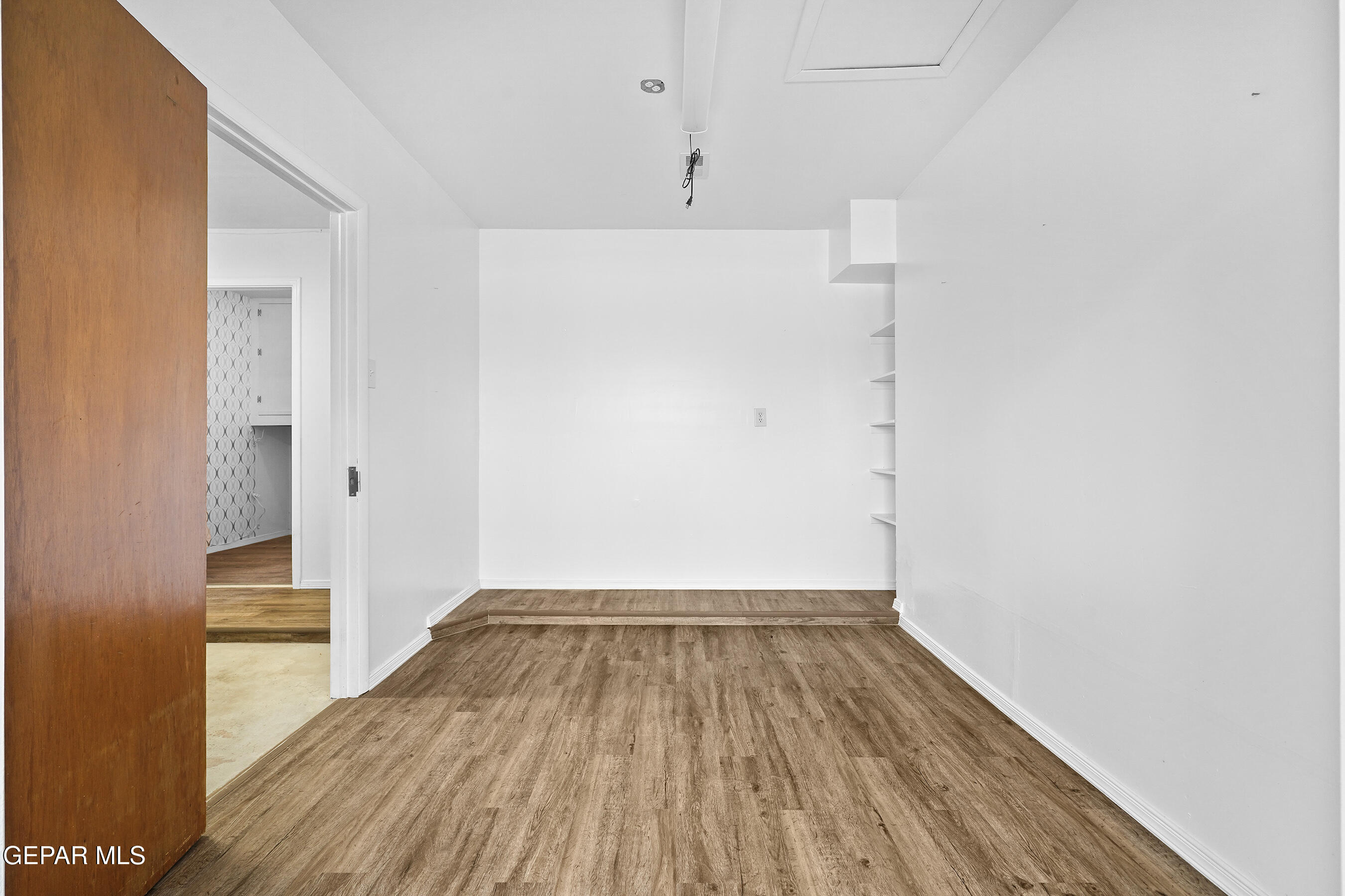 416 San Saba Road El Paso, TX 79912 - Photo 35 of 41 a view of a room with wooden floor