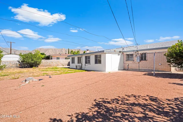 a view of a house with a snow in the yard