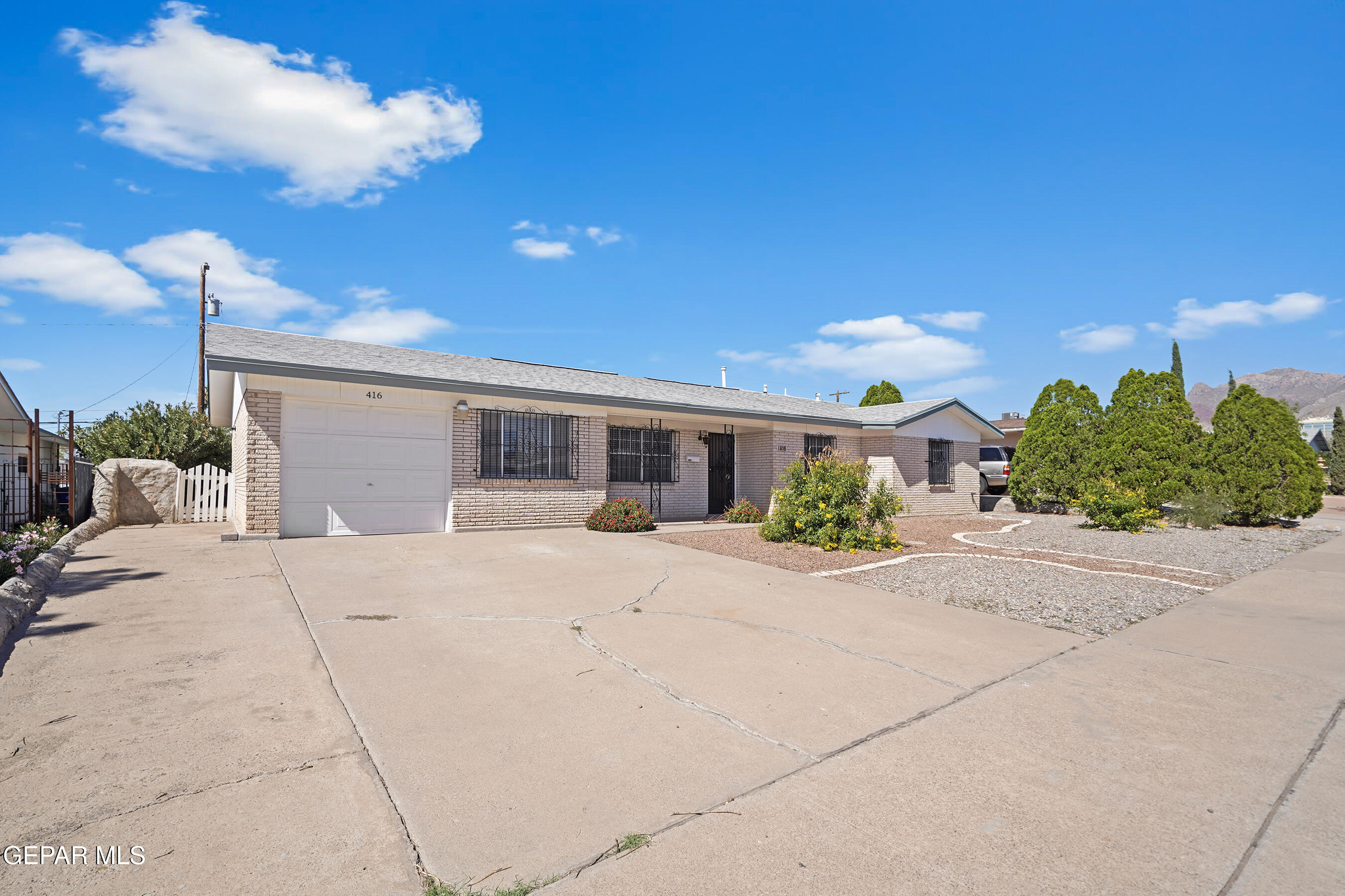 416 San Saba Road El Paso, TX 79912 - Photo 40 of 41 a view of a house with a yard and potted plants