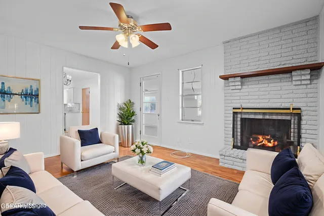 a living room with furniture and a fireplace
