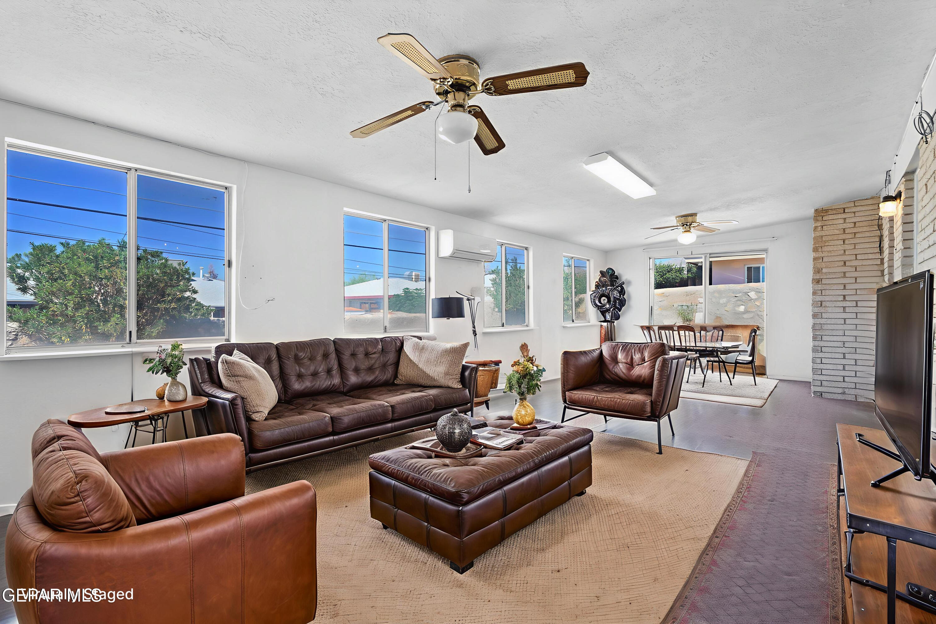 416 San Saba Road El Paso, TX 79912 - Photo 5 of 41 a living room with furniture ceiling fan and a rug