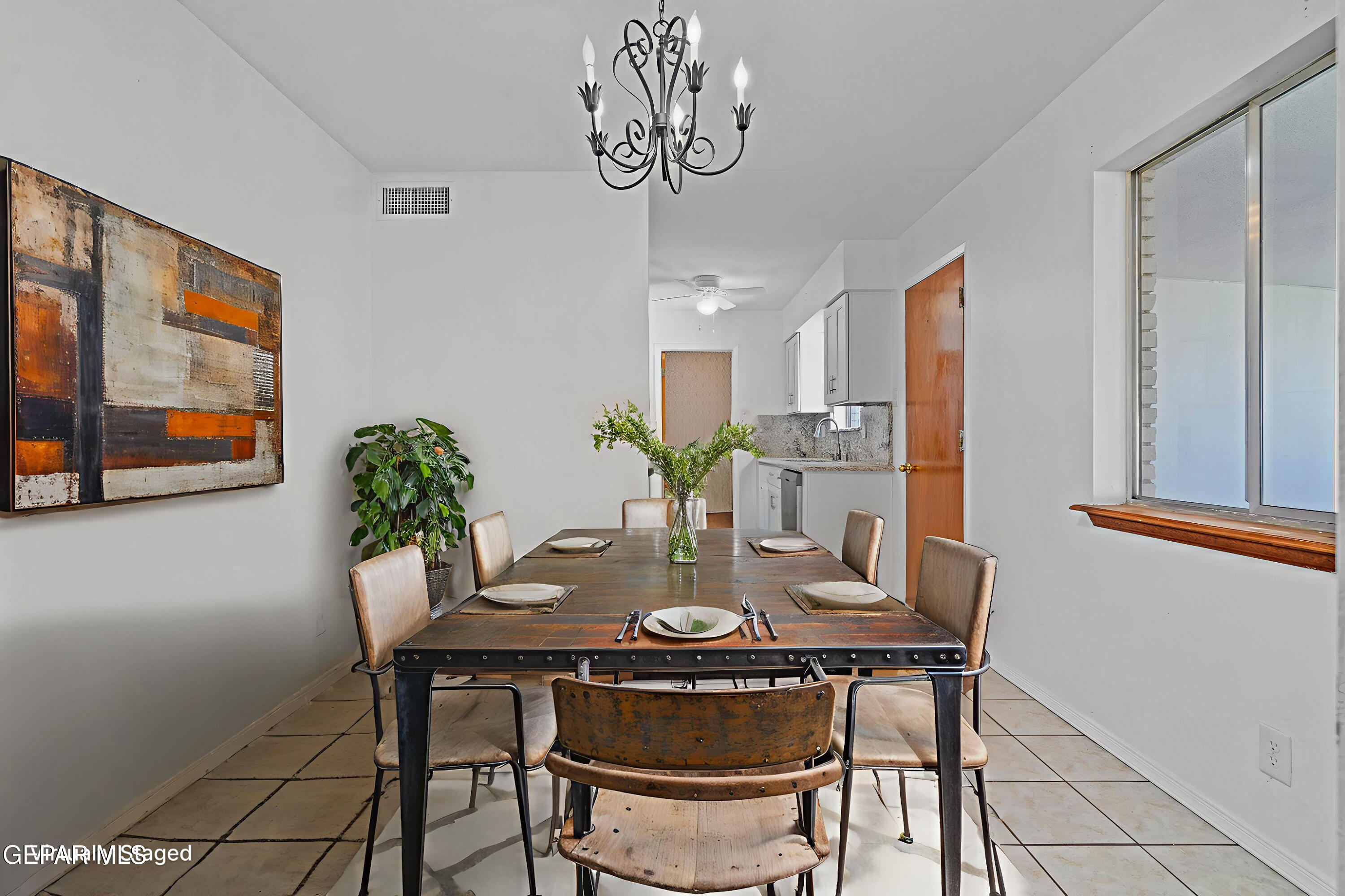416 San Saba Road El Paso, TX 79912 - Photo 6 of 41 a view of a dining room with furniture and wooden floor