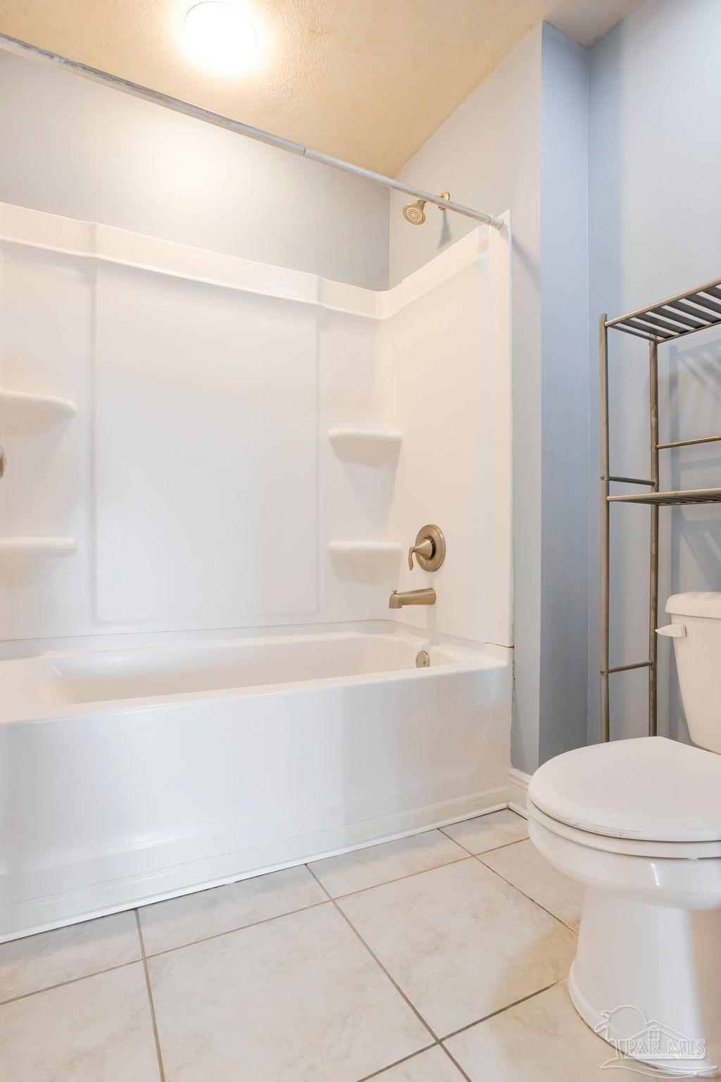 8016 Woodbrook Road Pensacola, FL 32526 - Photo 28 of 52 a bathroom with a toilet and a bathtub