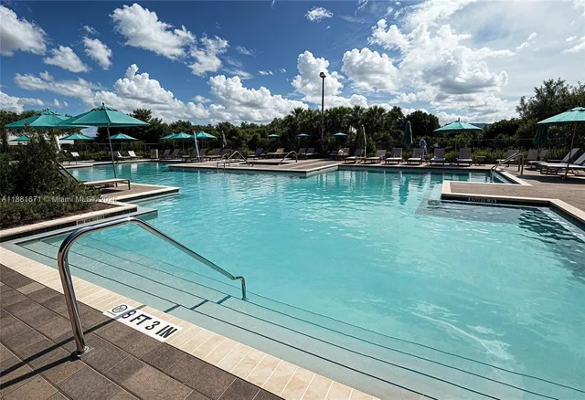 a view of swimming pool from a lake view