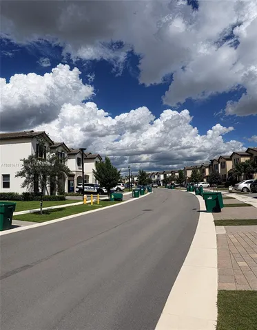 a view of a city street with a building