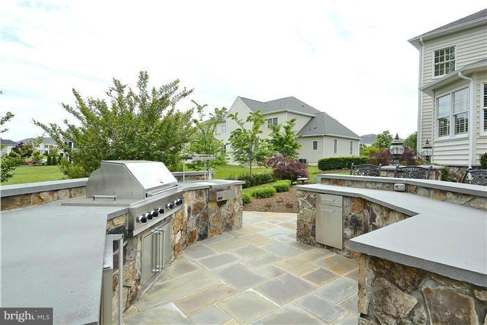 4468 Corral Road Warrenton, VA 20187 - Photo 9 of 30 Outdoor kitchen with grill, sink and refrigerator