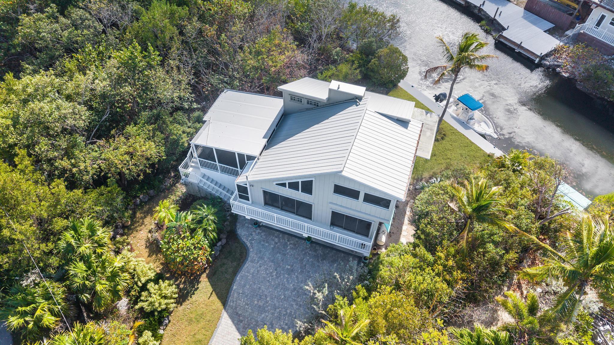 2148 Bahia Shores Road Big Pine Key, FL 33043 - Photo 1 of 35 a view of a house with a yard and garden