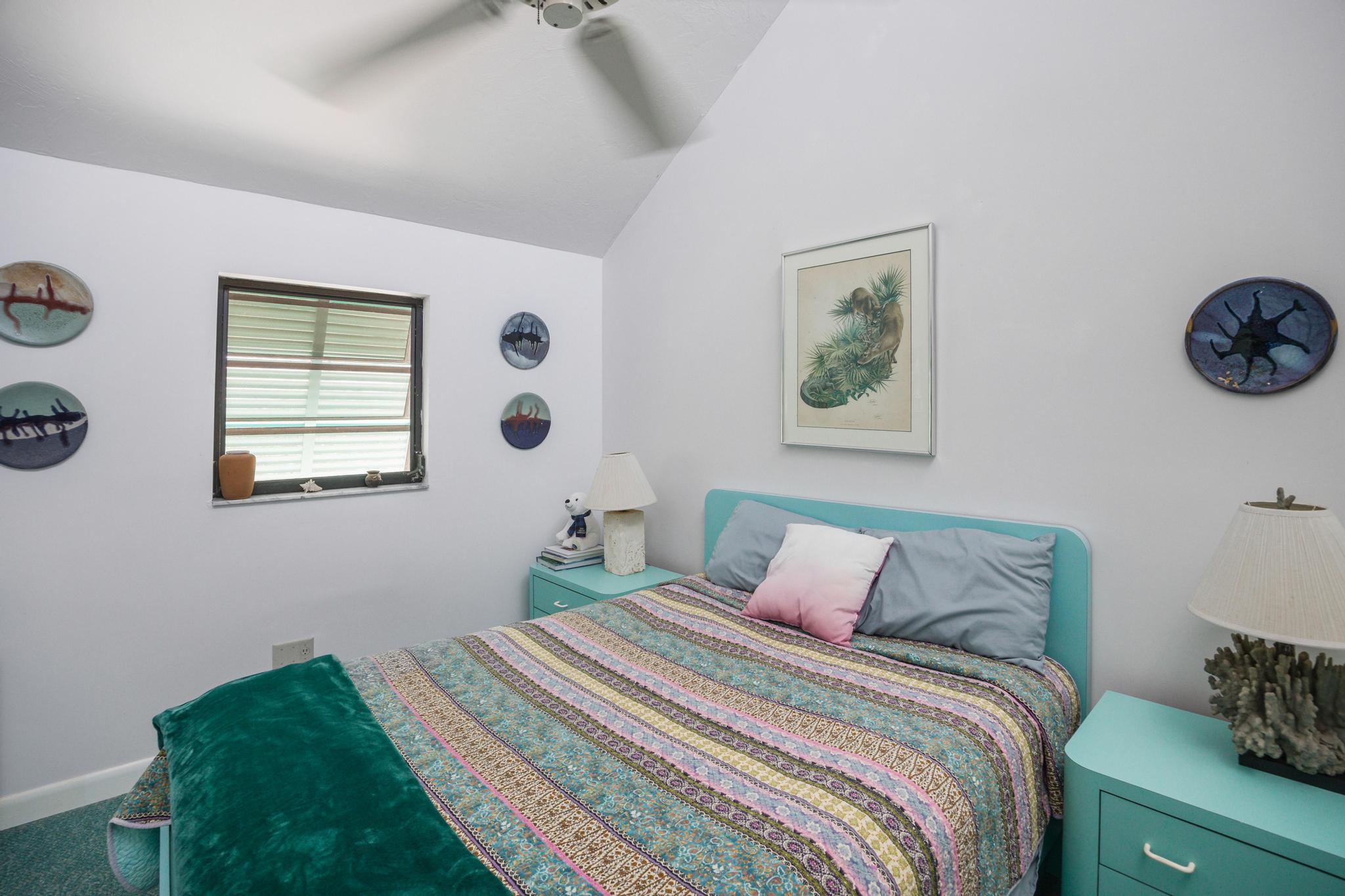 2148 Bahia Shores Road Big Pine Key, FL 33043 - Photo 10 of 35 a bedroom with a bed and a window
