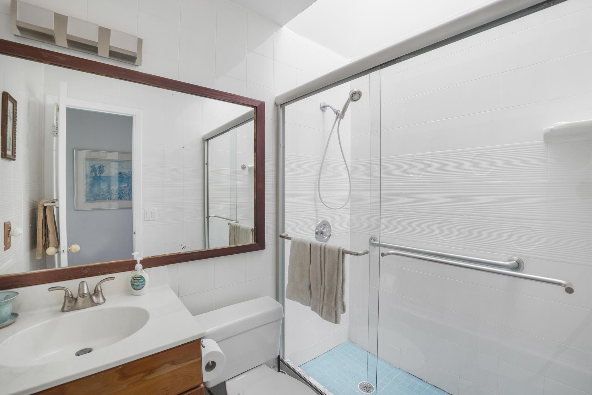 2148 Bahia Shores Road Big Pine Key, FL 33043 - Photo 12 of 35 a bathroom with a sink and a mirror