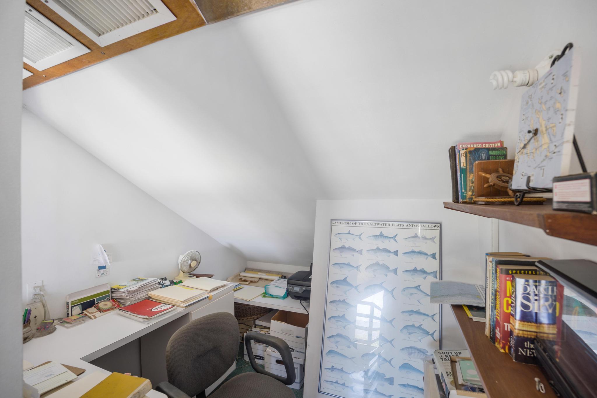 2148 Bahia Shores Road Big Pine Key, FL 33043 - Photo 15 of 35 a utility room with cabinets and dust bin