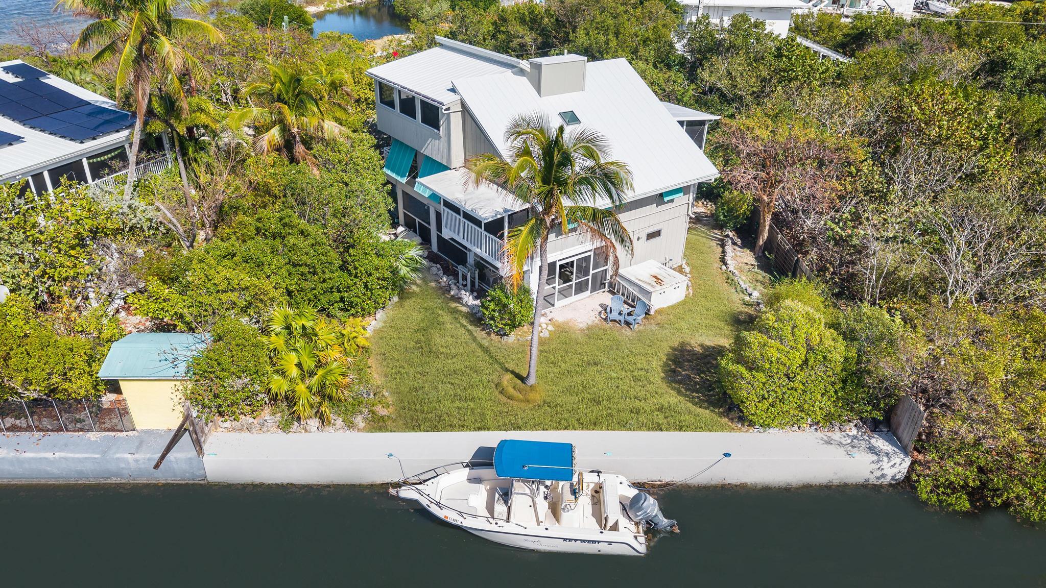2148 Bahia Shores Road Big Pine Key, FL 33043 - Photo 28 of 35 an aerial view of a house with a yard and lake view