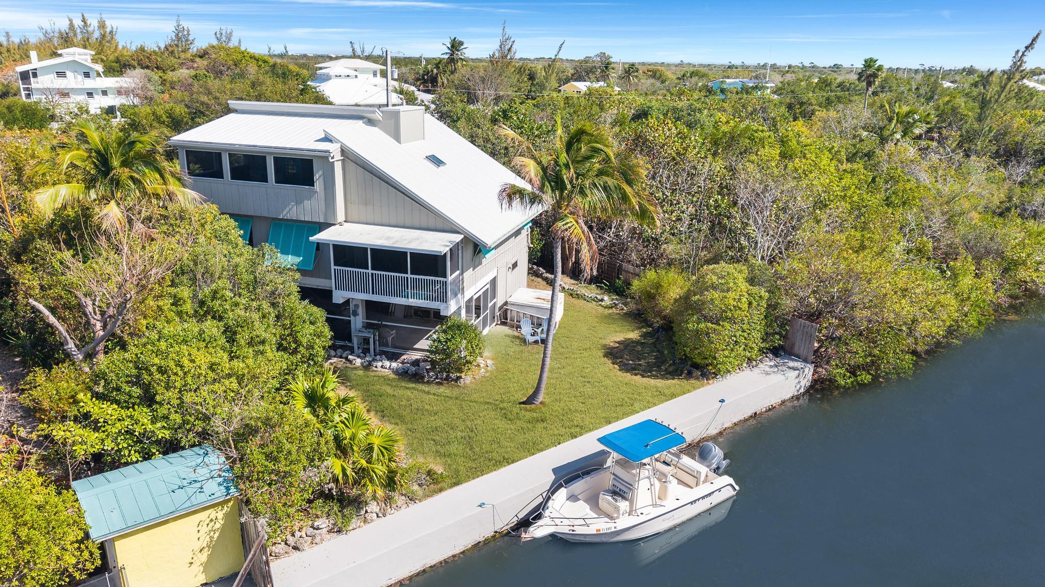 2148 Bahia Shores Road Big Pine Key, FL 33043 - Photo 3 of 35 a view of a house with a yard