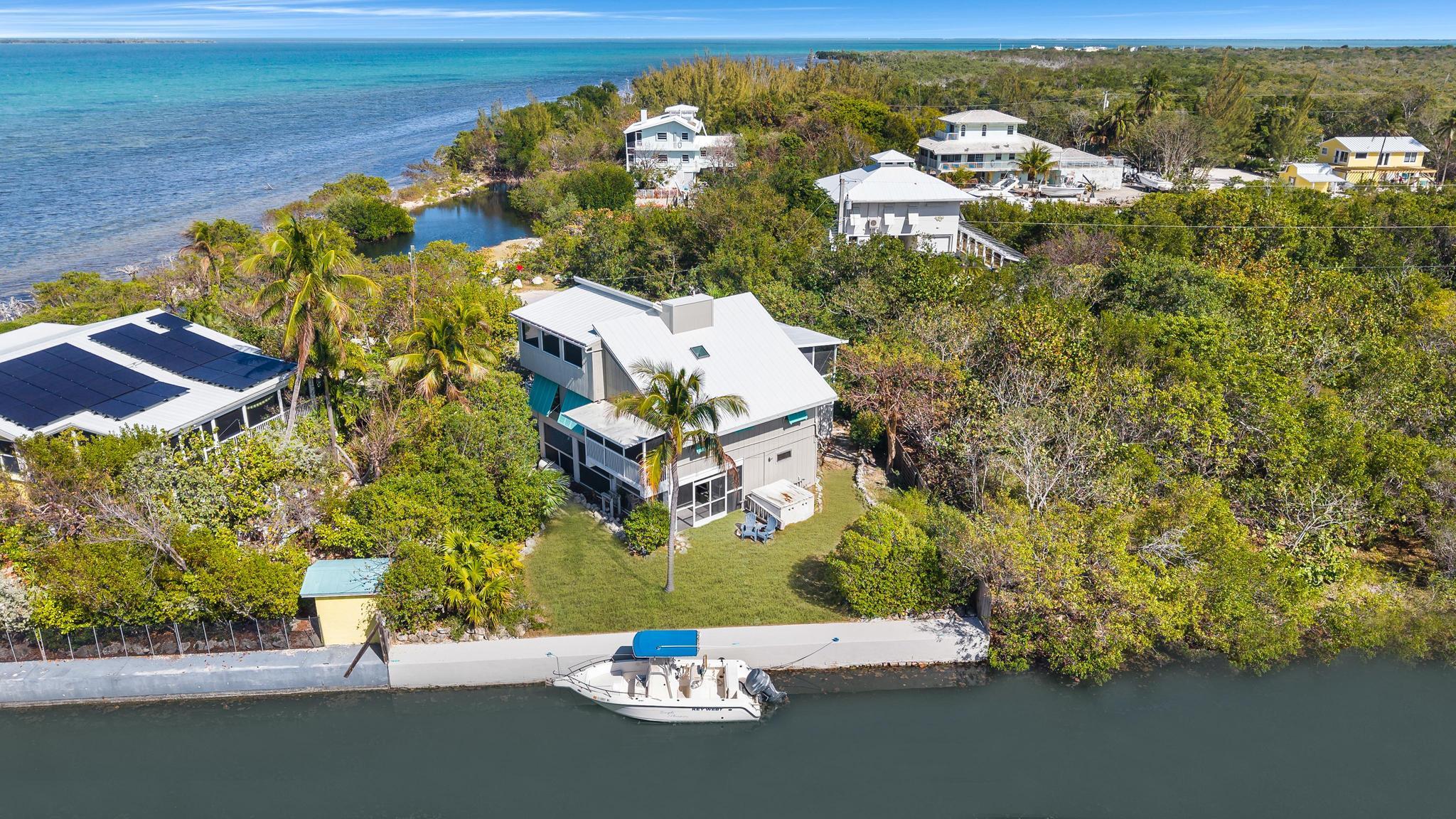 2148 Bahia Shores Road Big Pine Key, FL 33043 - Photo 30 of 35 an aerial view of a house with a lake view